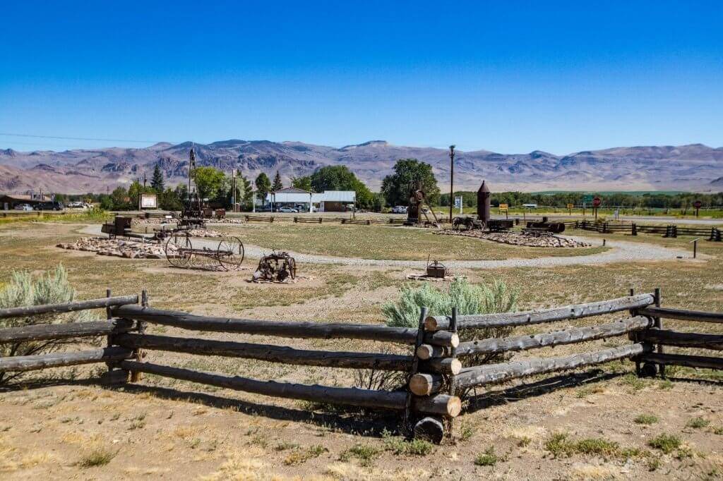 wood fence with interpretive exhibits in background