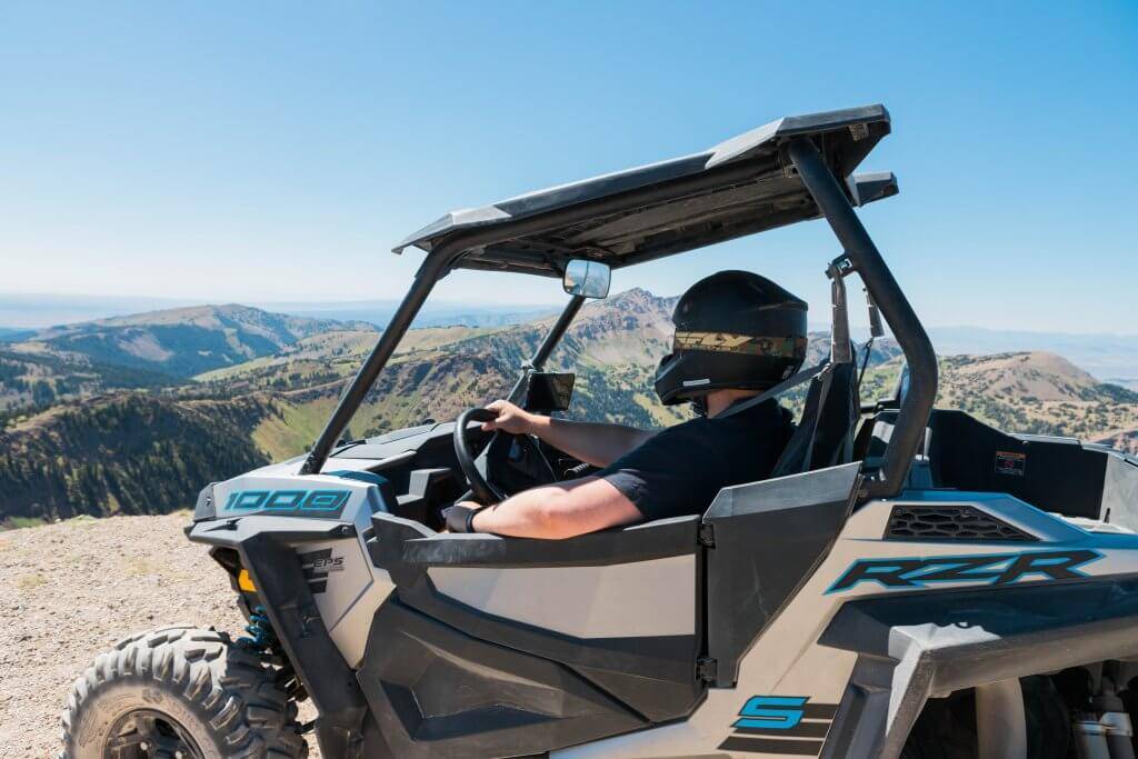 person sitting in side by side looking at mountain views