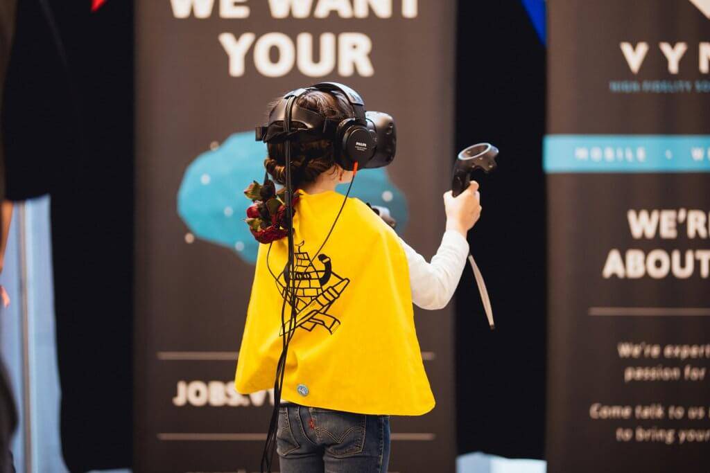 CHILD PLAYING VIRTUAL REALITY GAME