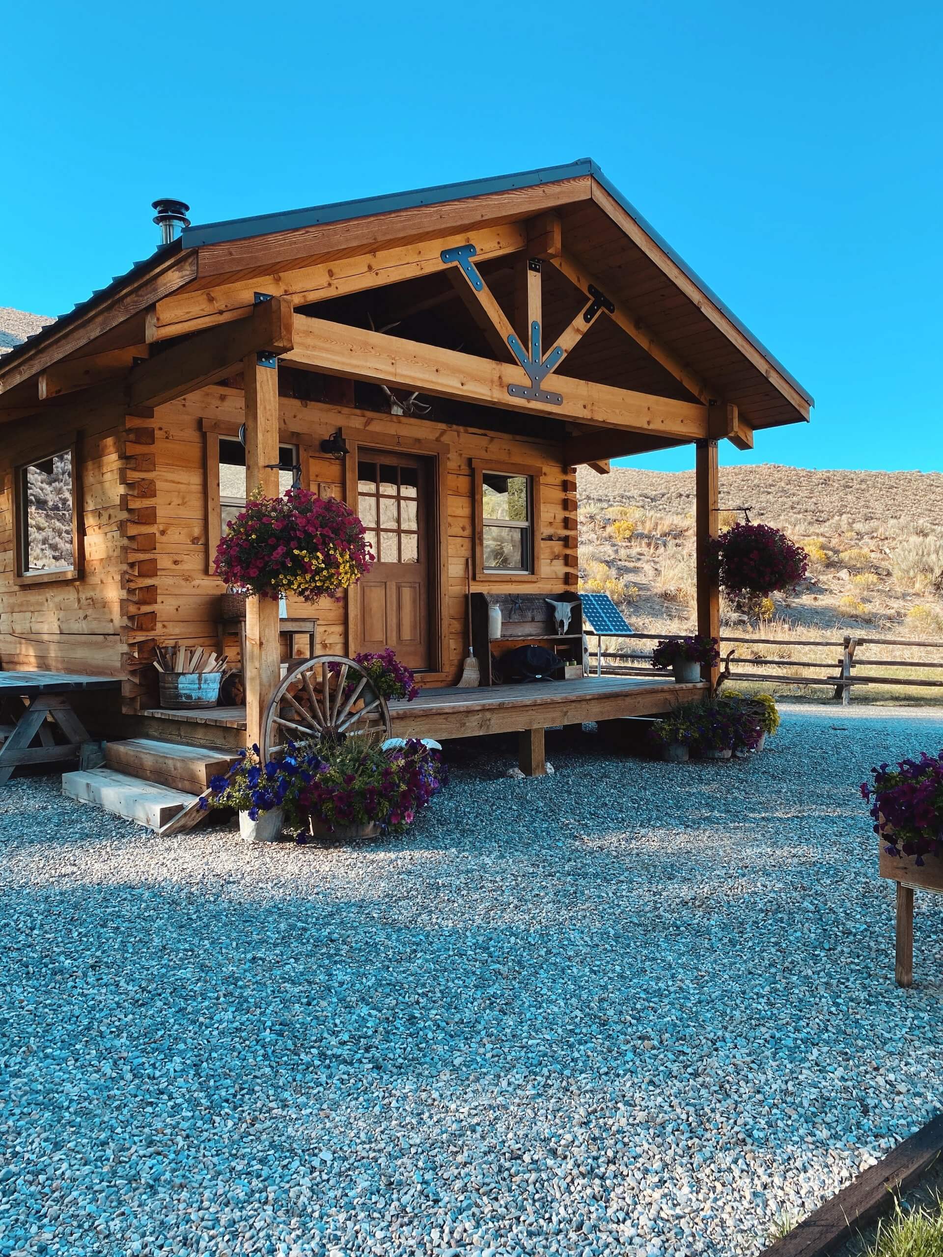 decorated with western memorabilia and flowers, the I Bar Ranch Cabin in Challis sits on a hillside