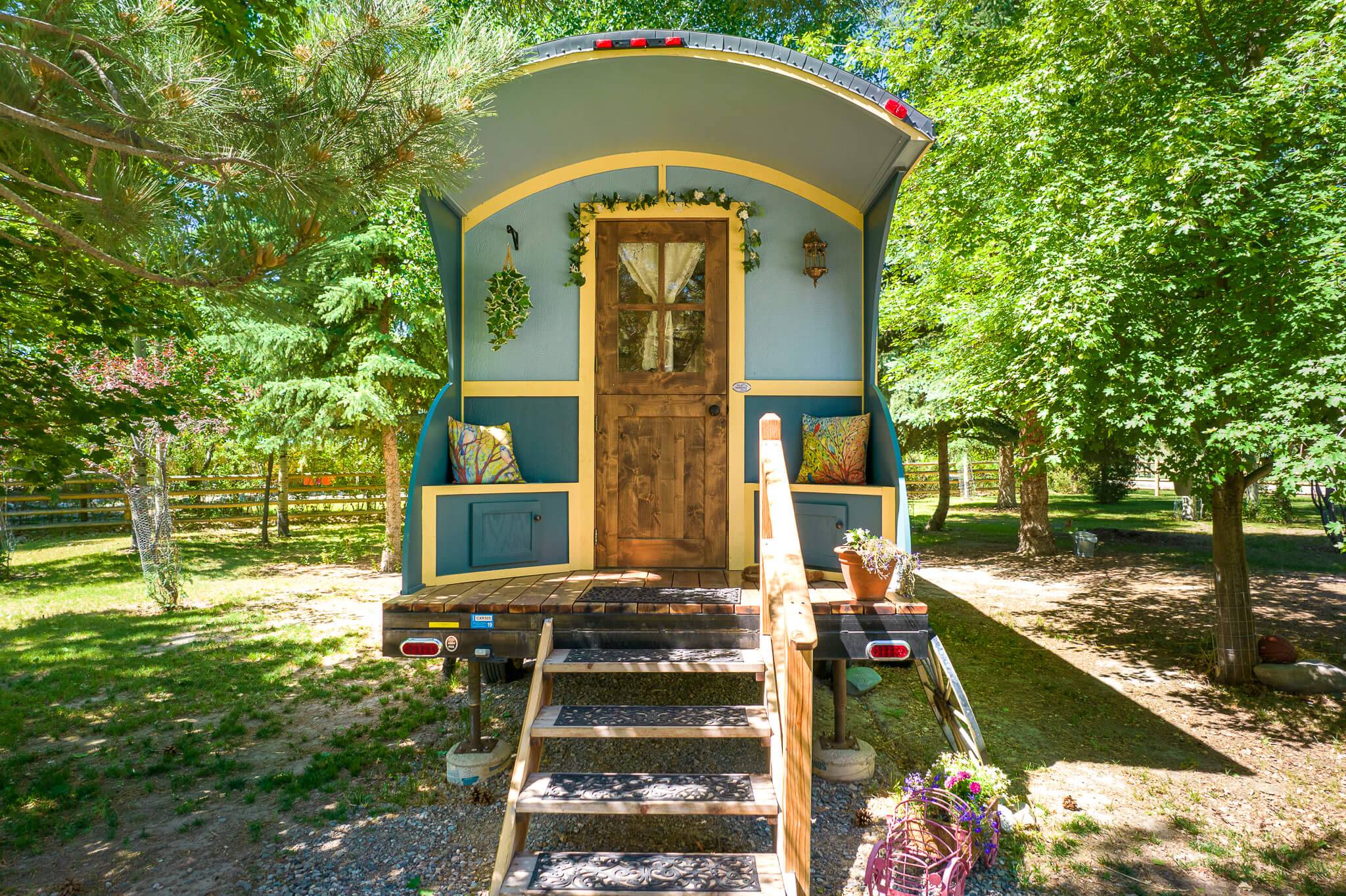 The sun shines on the colorful exterior of the Salmon Gypsy B&B Wagons in Salmon, Idaho.