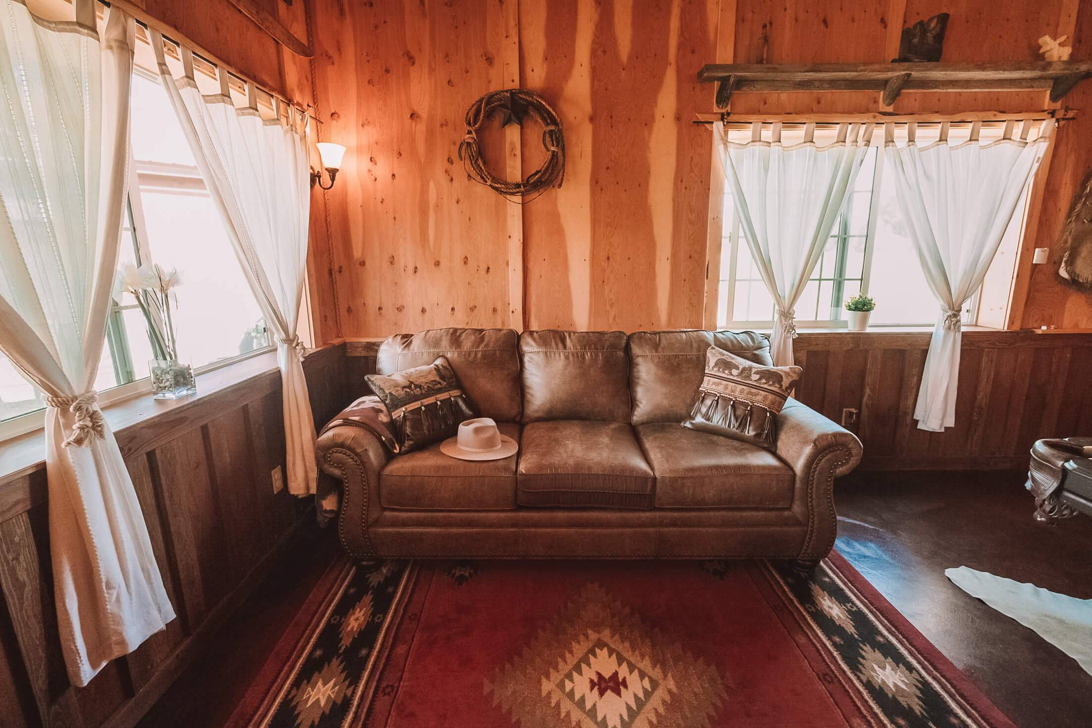 A glimpse into the cozy, rustic bedroom interior of the Western Saloon in Tetonia, Idaho.