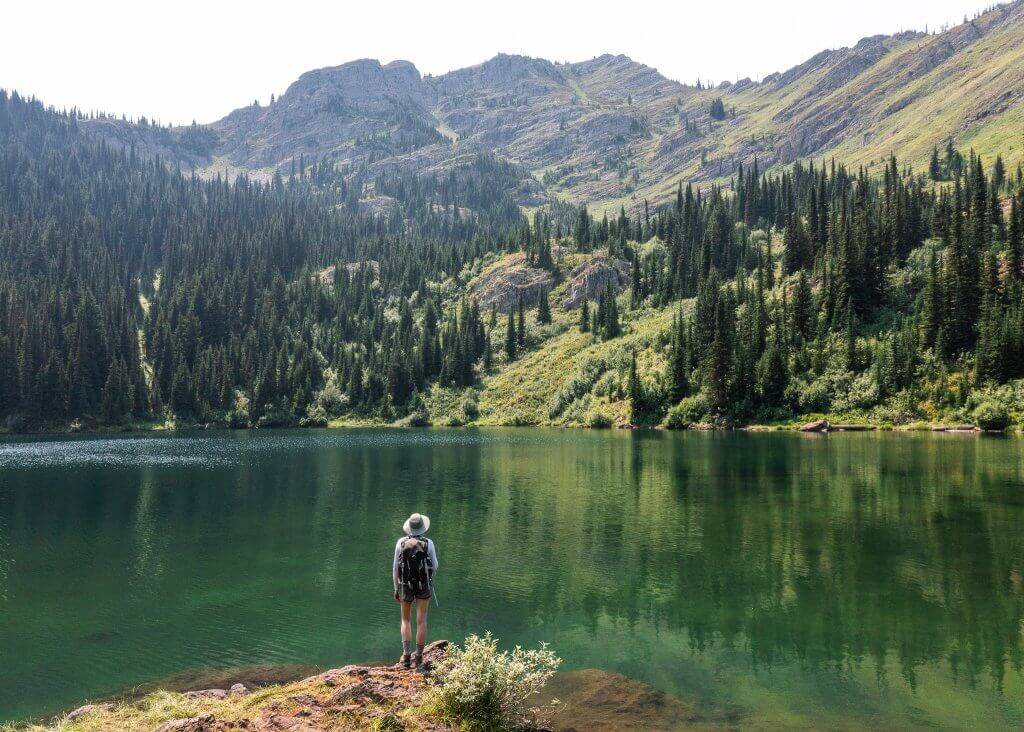 man looking at upper stevens lake