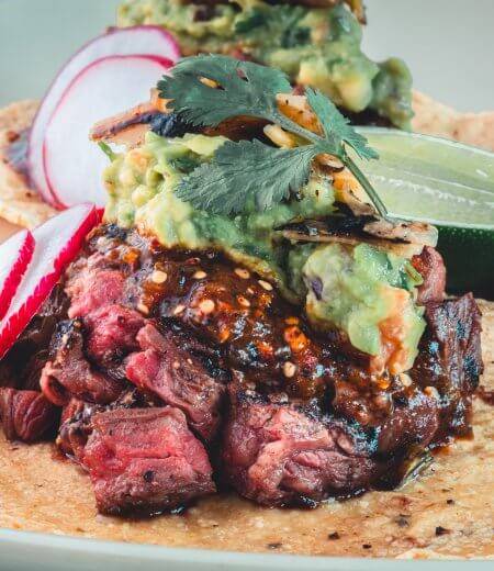 carne asada tacos with radishes and lime