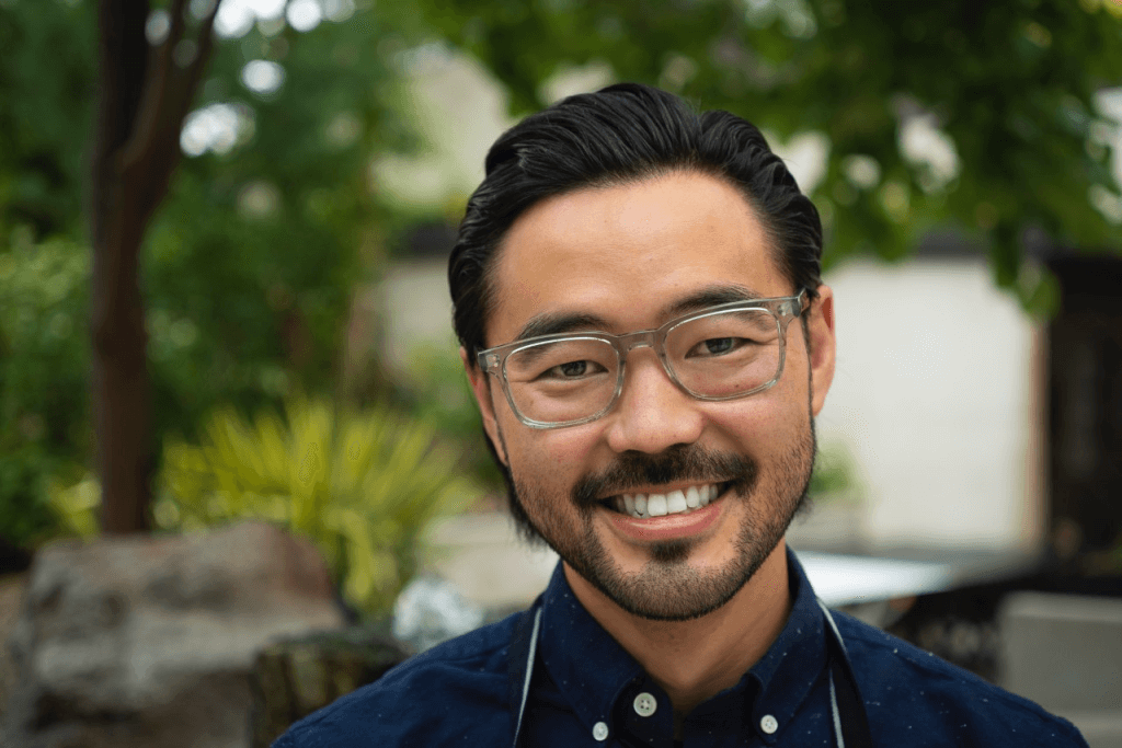 A headshot of KIN chef Kris Komori in an outdoor setting.