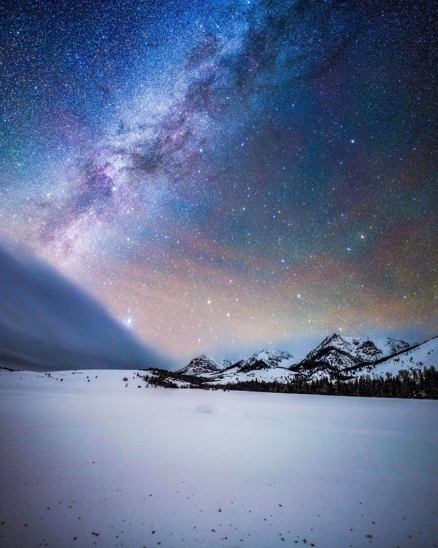 The Milky Way and stars over the snow covered Boulder Mountains in Central Idaho.