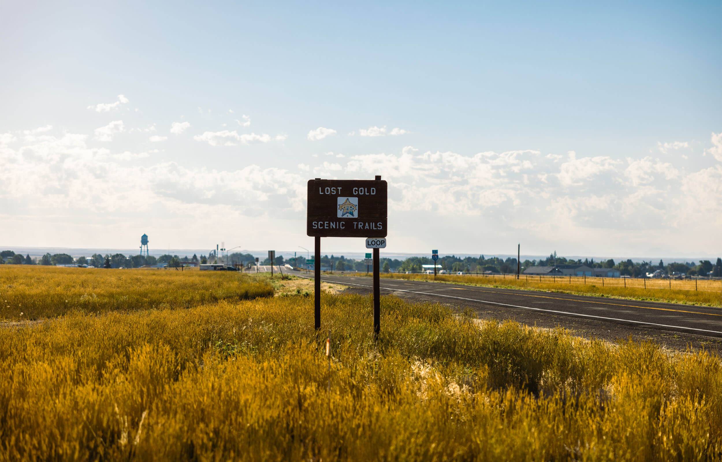 A roadside sign for Lost Gold Scenic Trails Loop.