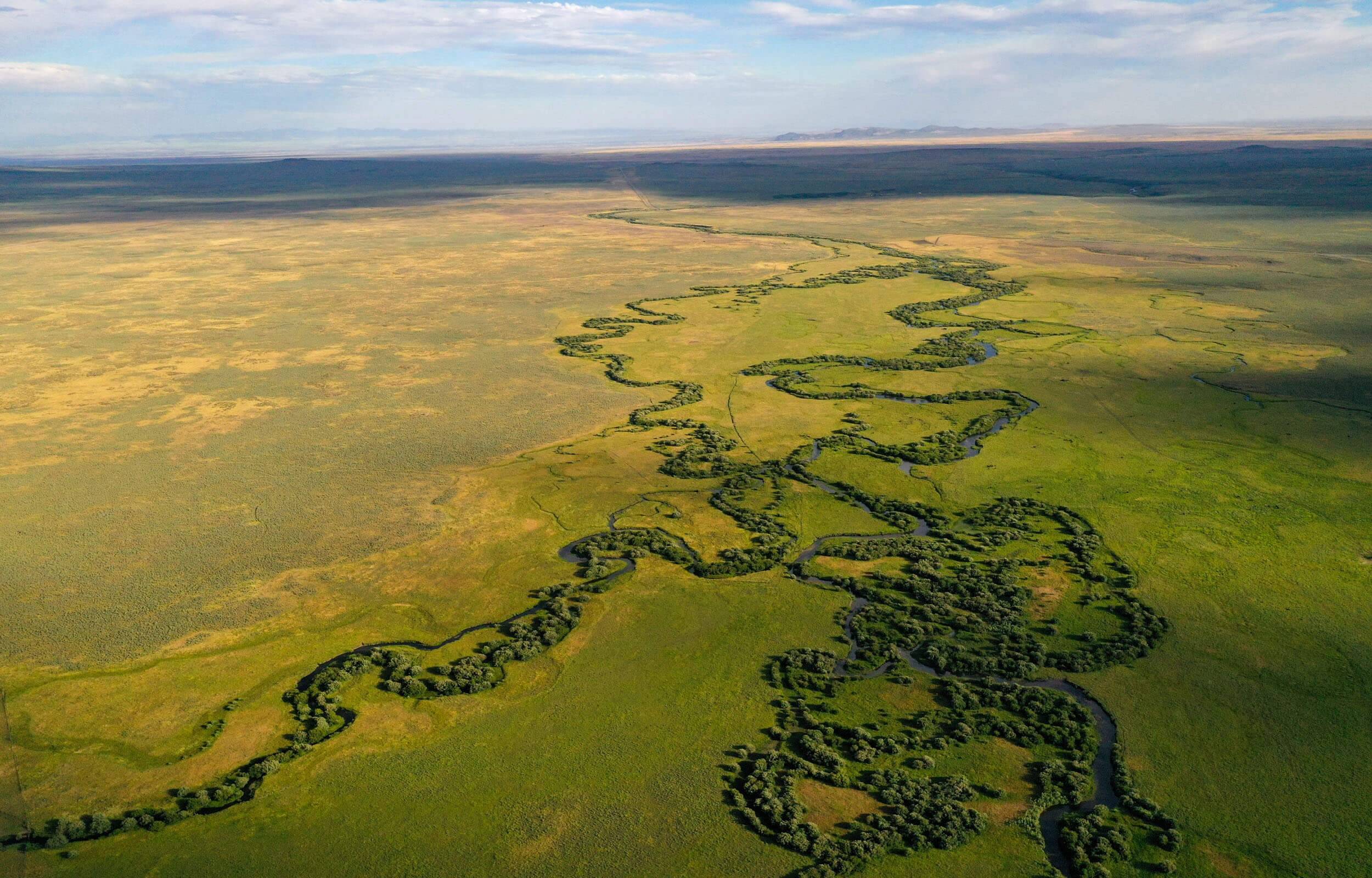 Aerial view of creek and prairie land south of Kilgore, Idaho.