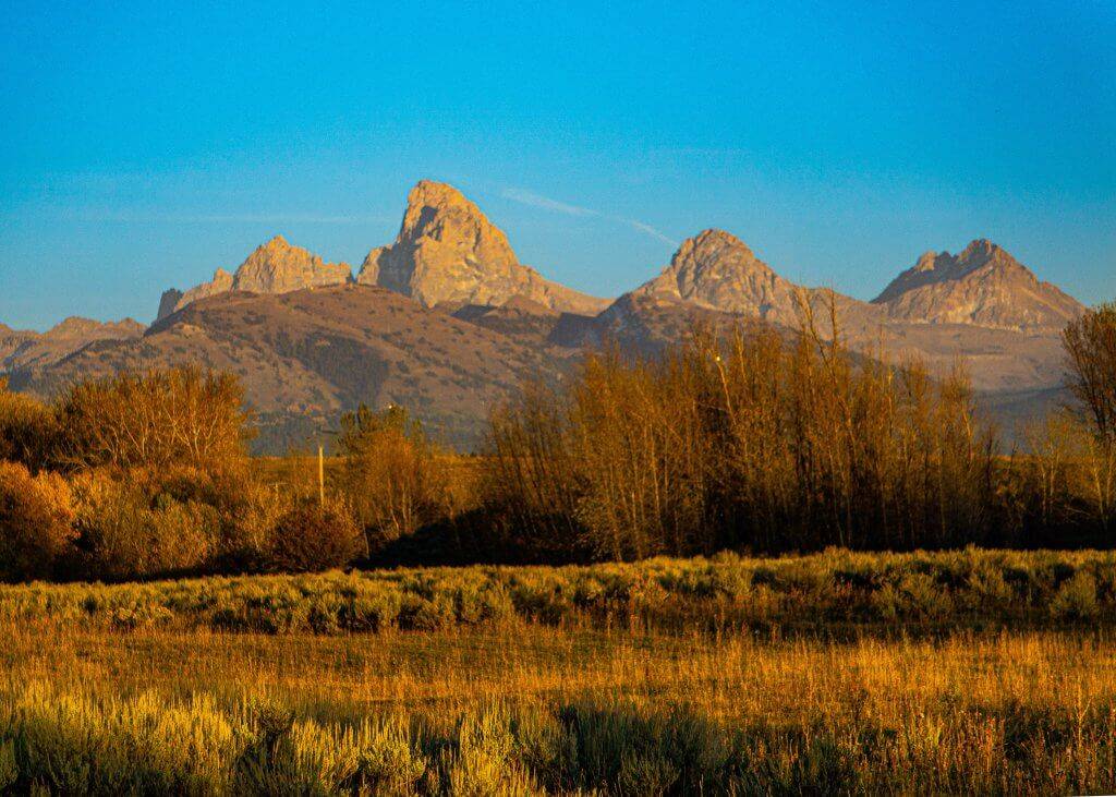 wide shot of rugged Grand Teton Mountains