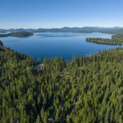 Aerial view of Indian Creek Bay at Priest Lake, surrounded by forest in Priest Lake State Park.