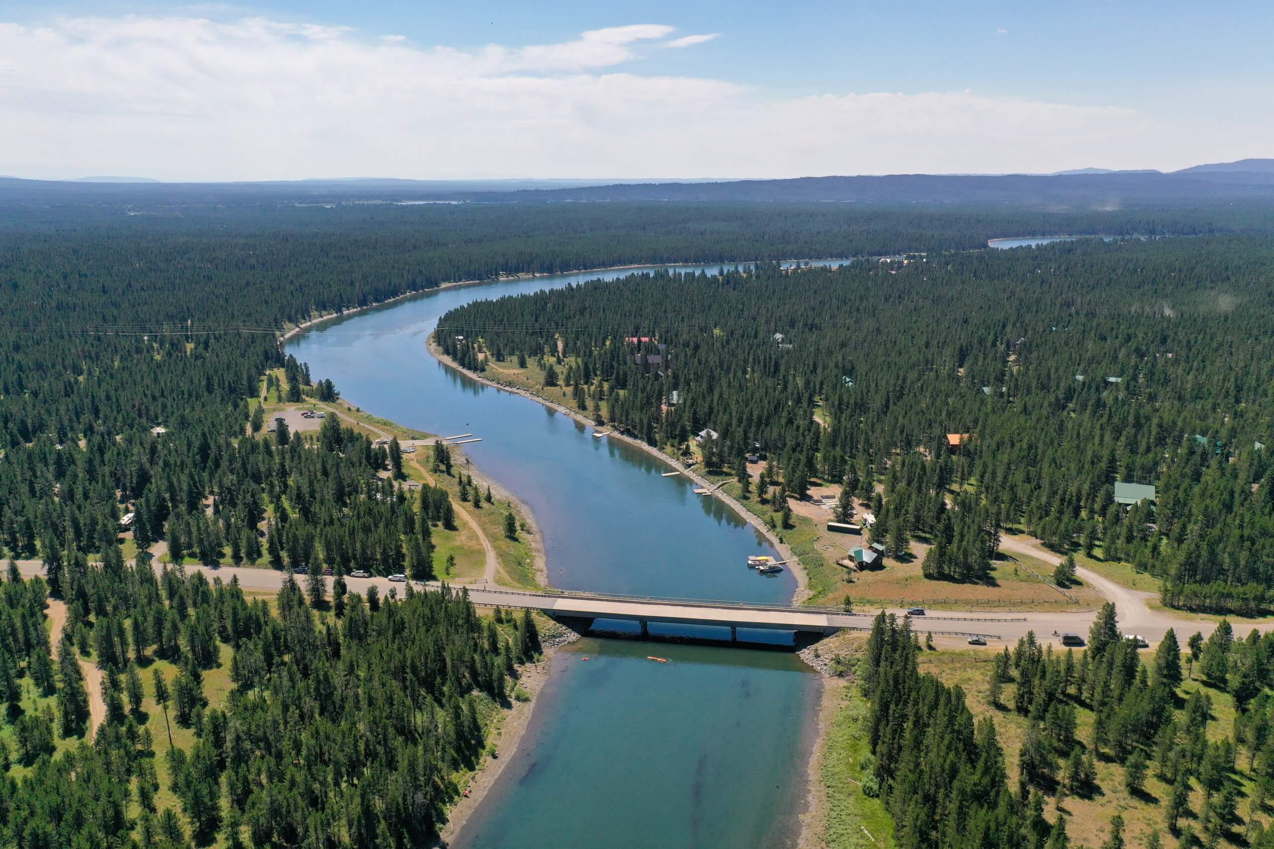 McCrea bridge crossing the tree-lined henry's fork of the snake river.