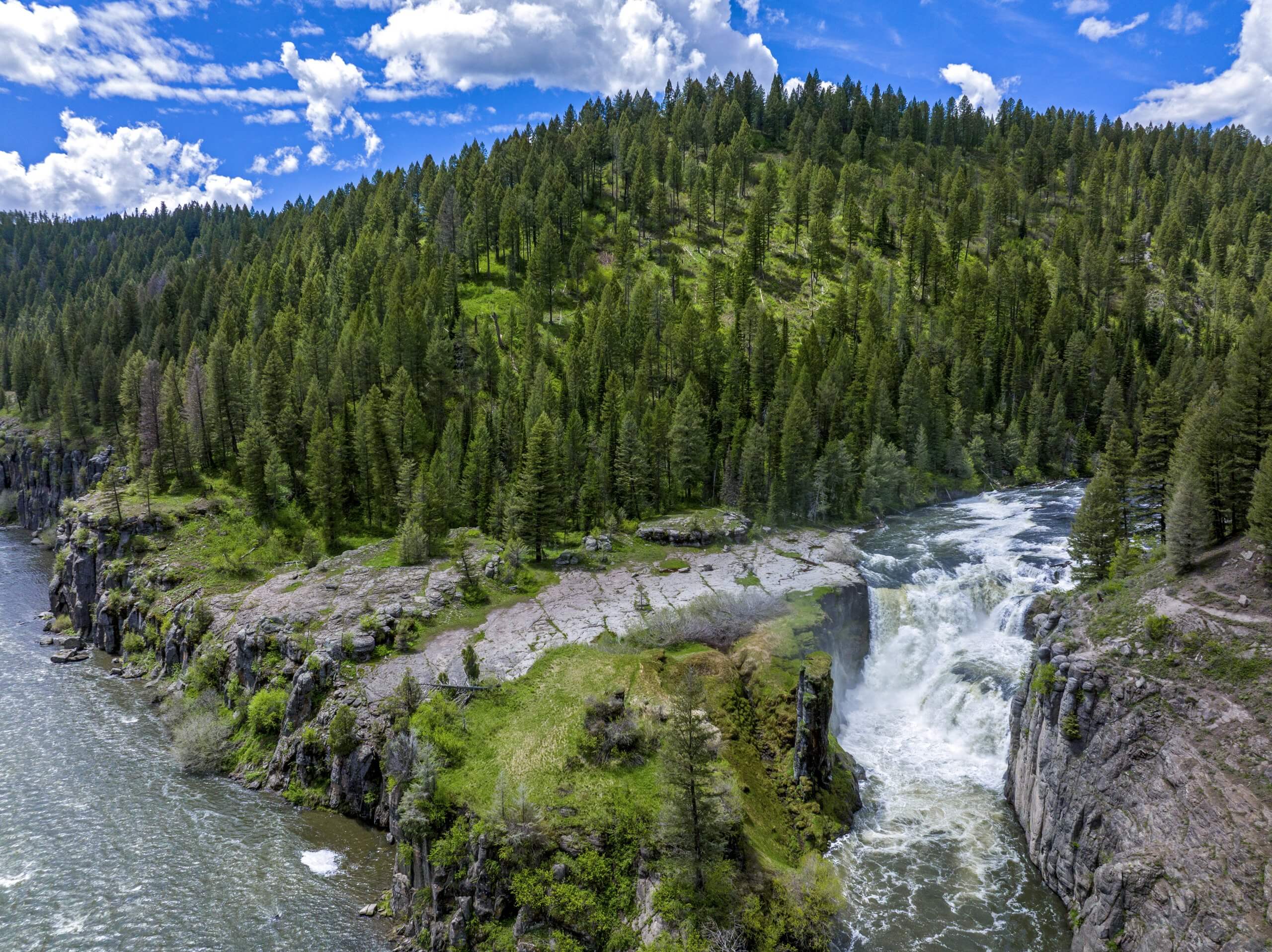 An aerial shot of Lower Mesa Falls and the Henry's Fork River.