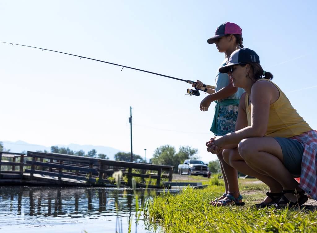 A mother and daughter fishing at Kids Creek Pond in Salmon.