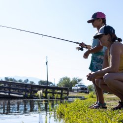 A mother and daughter fishing at Kids Creek Pond in Salmon.