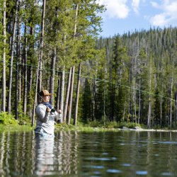 A person throws a fishing line into Wallace Lake.