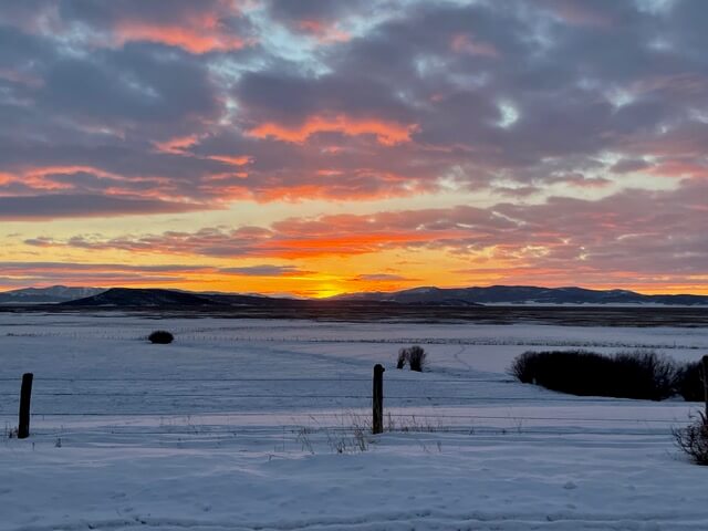 A wintertime view of Grays Lake National Wildlife Refuge during sunset.