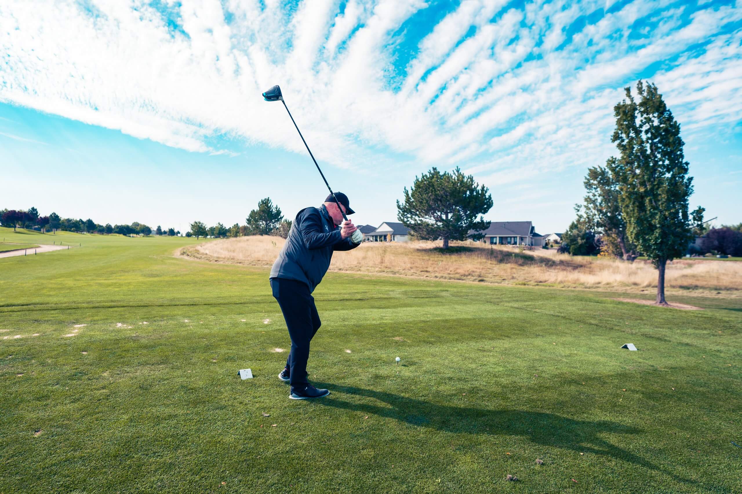 Man tees off at Timberstone Golf Course. 