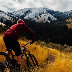 Man climbs Gibson Jack Loop on mountain bike outside Pocatello Idaho.