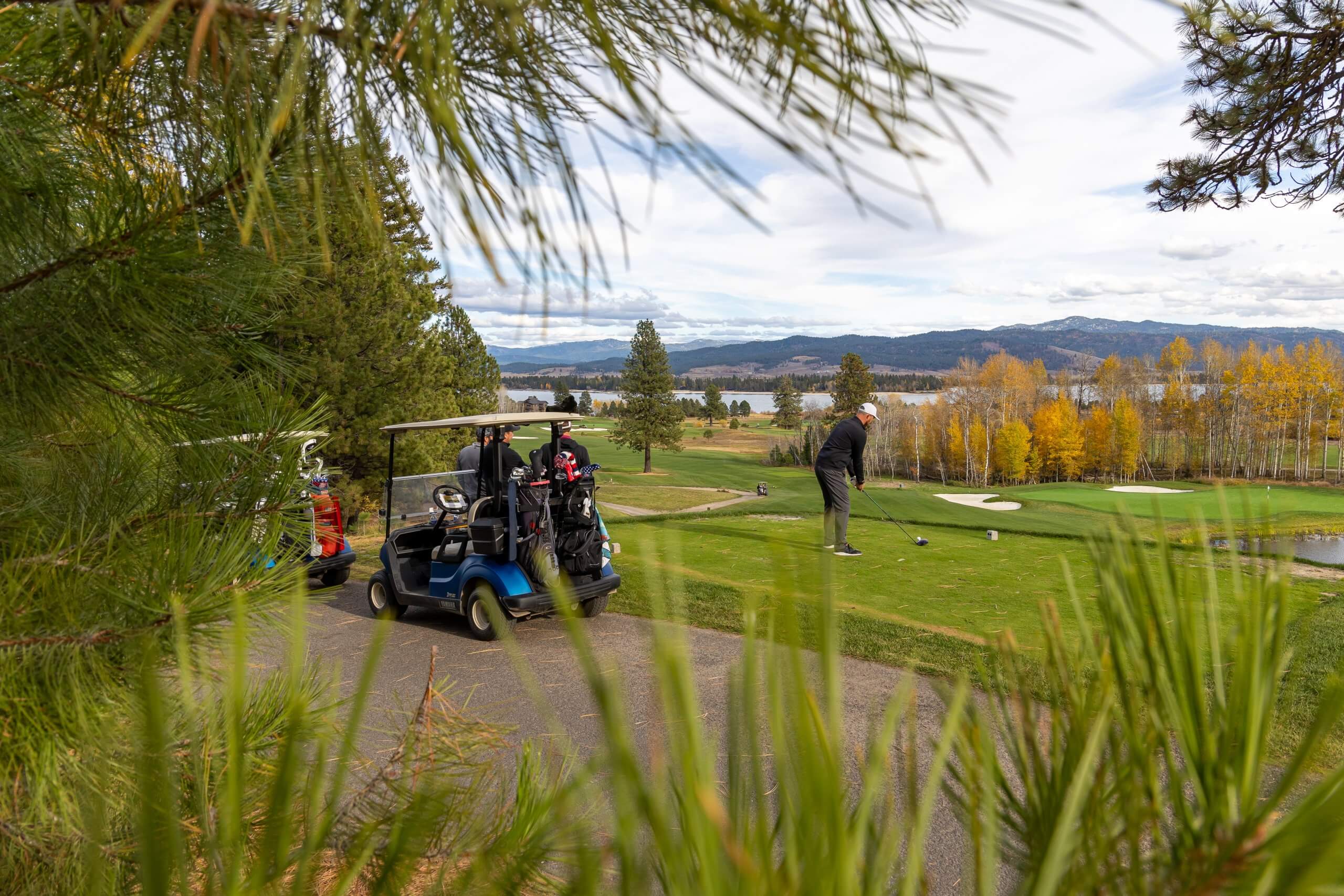 group of people golf in fall