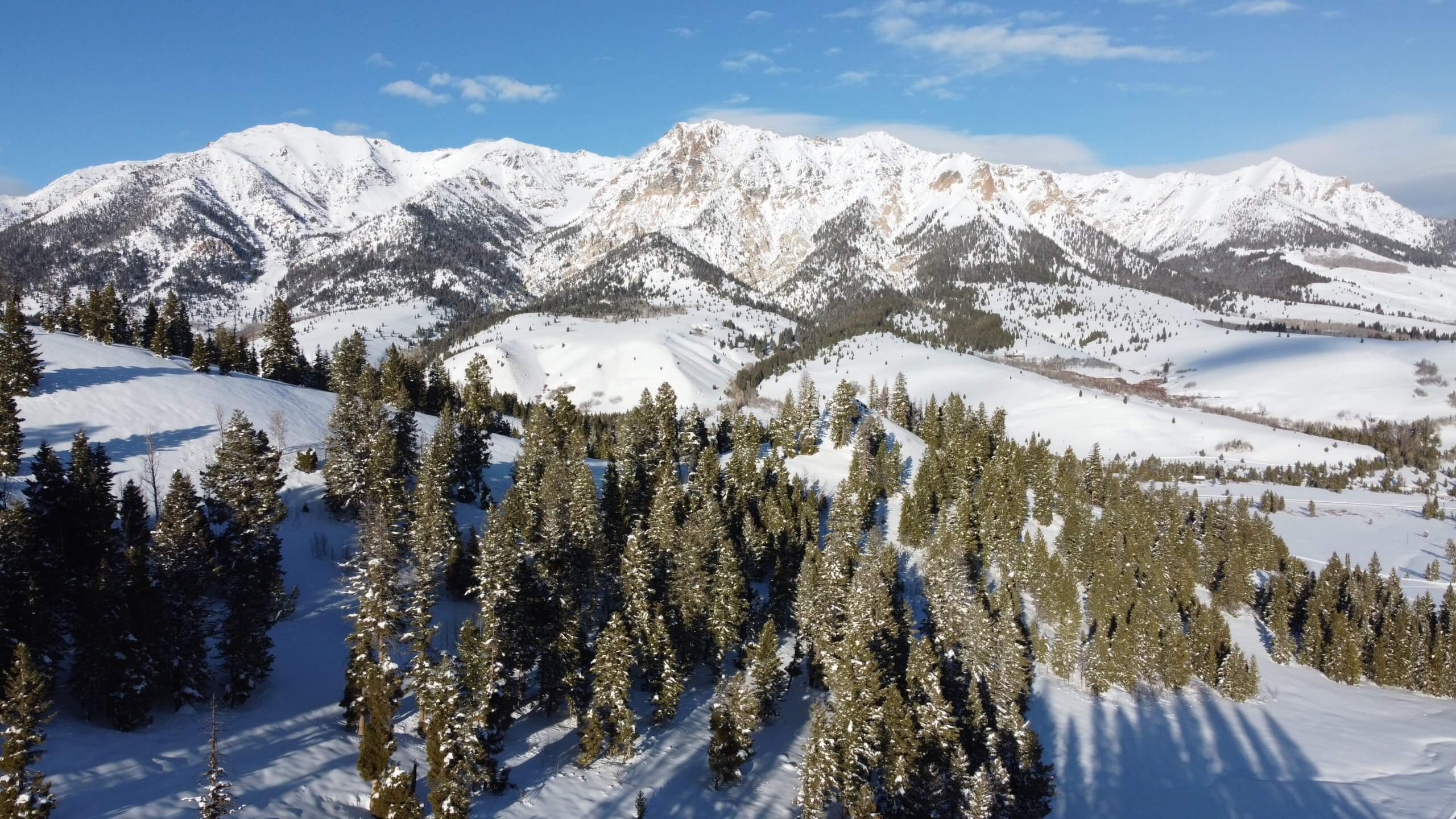 Views of the mountains covered in snow at Boulder Yurt.