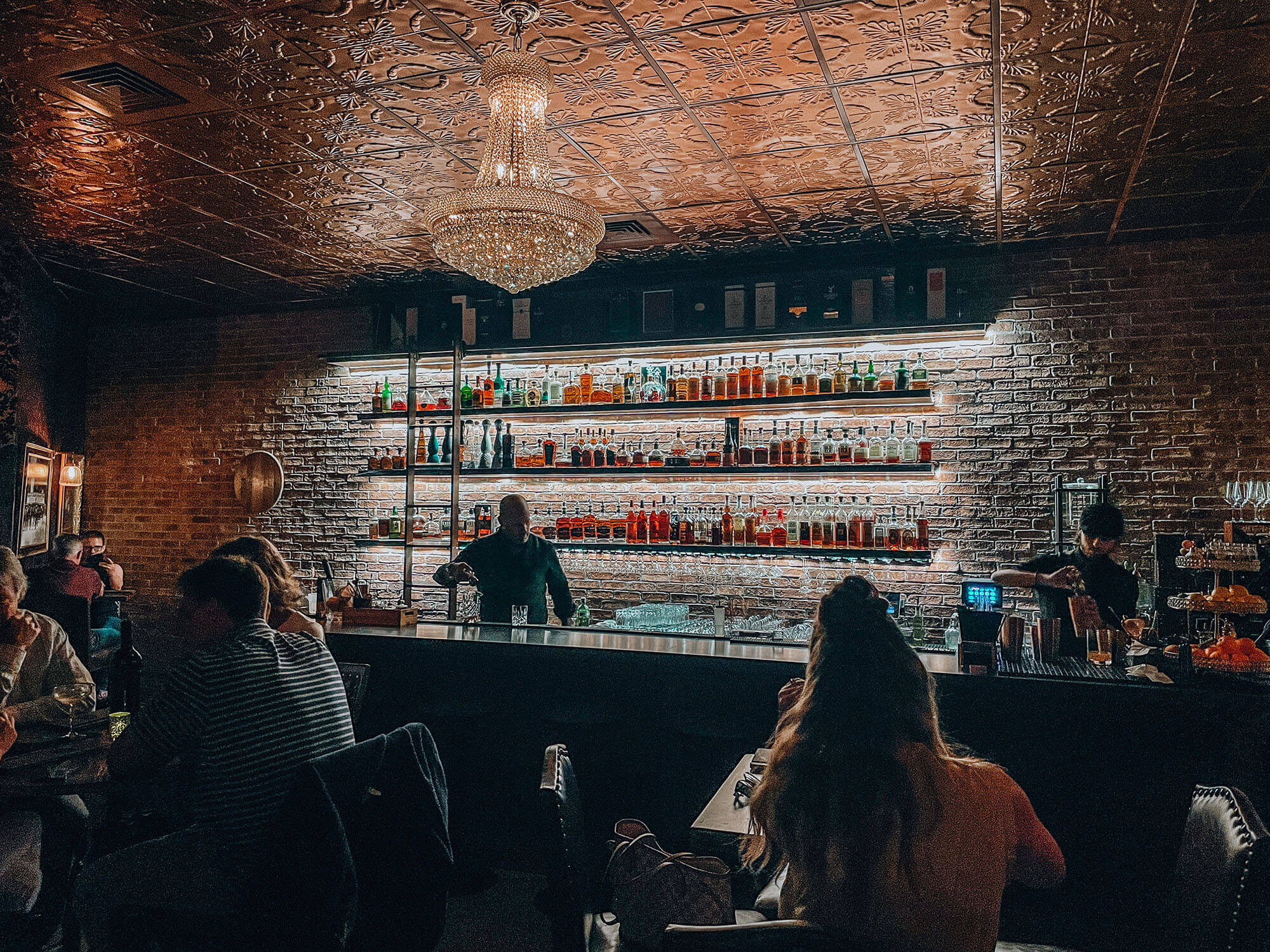 People ordering cocktails at a downtown Boise bar. 