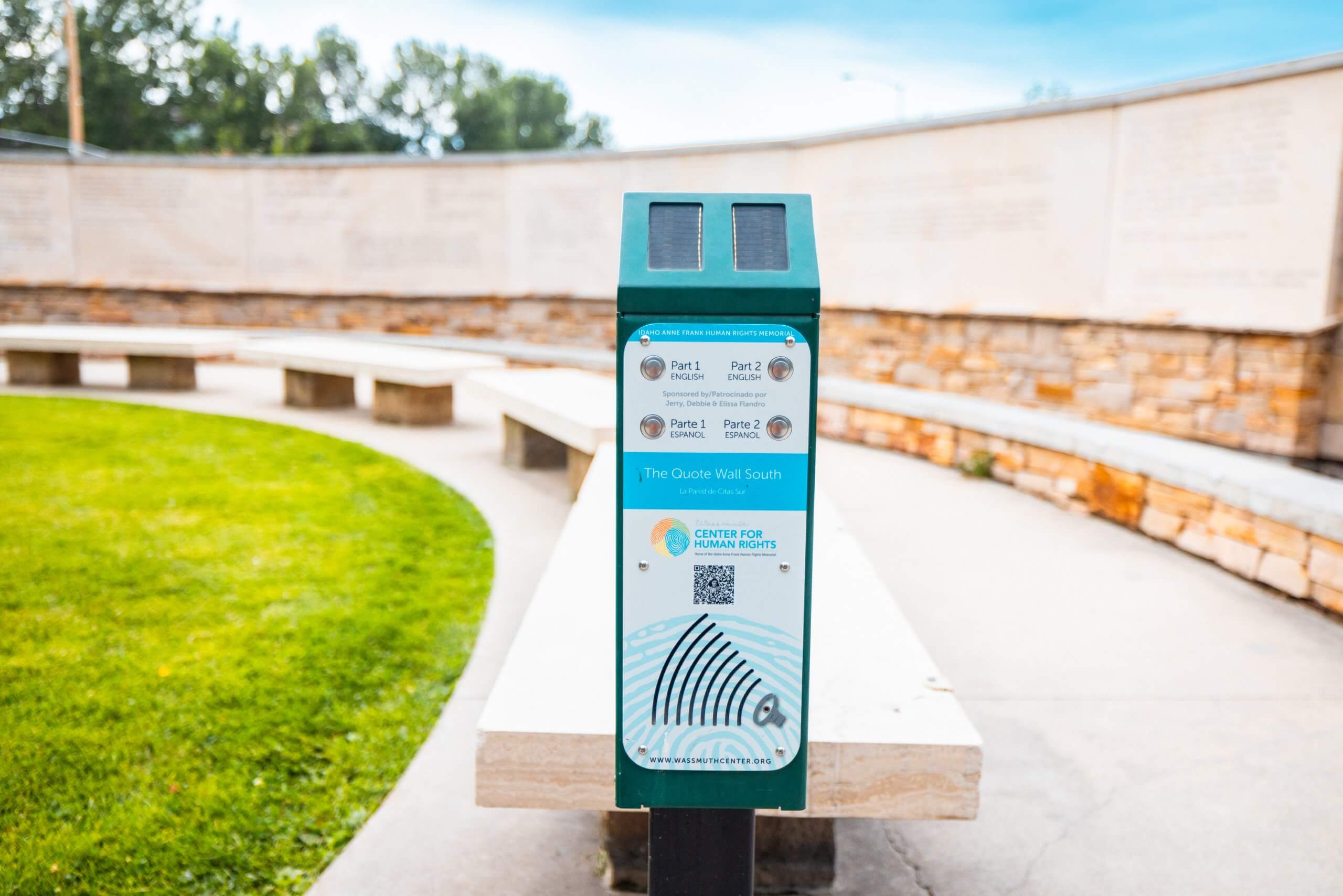 A education kiosk with four silver buttons at the Idaho Anne Frank Human Rights Memorial.