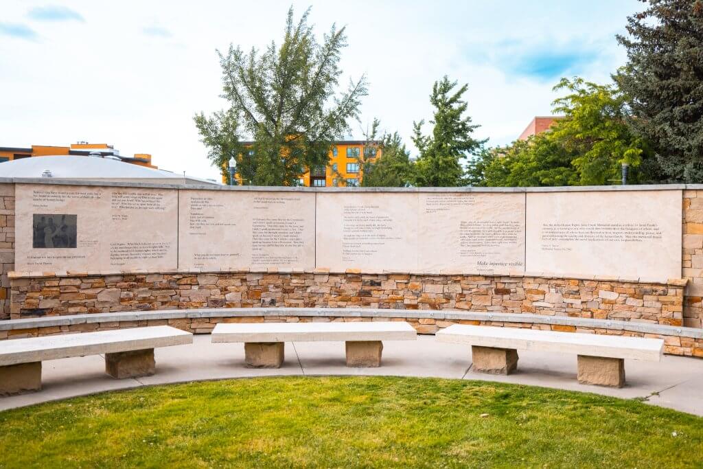 A portion of a circular wall with quotes on the wall panels at the Idaho Anne Frank Human Right Memorial.