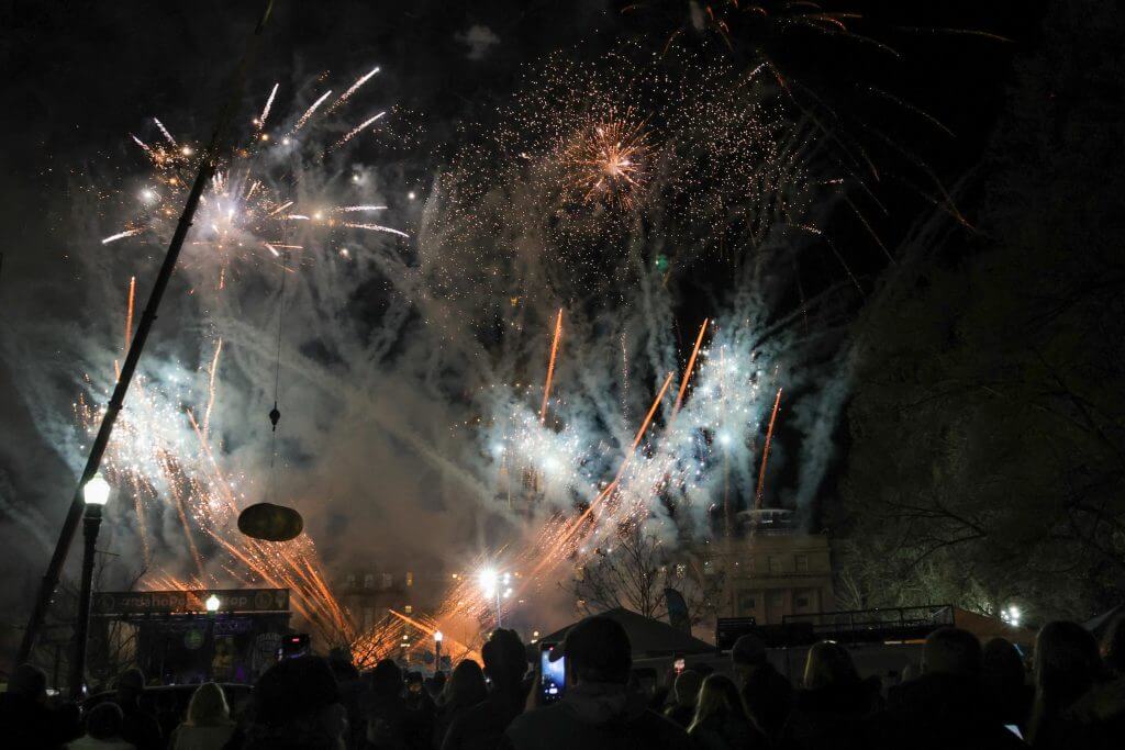 The GlowTato being dropped at the Idaho Potato Drop before a sky filled with fireworks at the Idaho State Capitol.