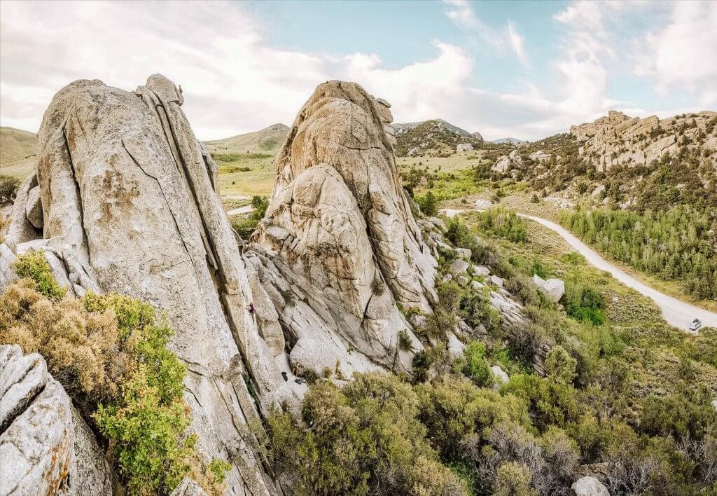 View of giant rocks surrounded by shrubs at City of Rocks National Reserve.