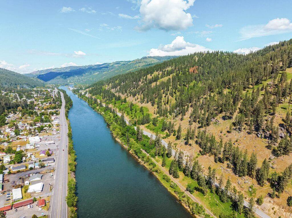 Aerial shot of the Clearwater River running alongside the town of Orofino.