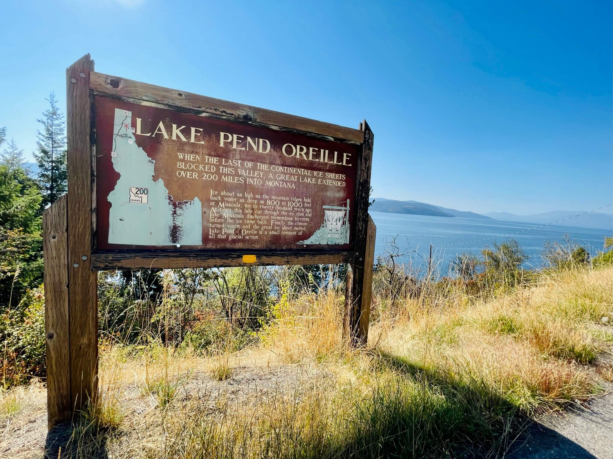 road sign with lake 