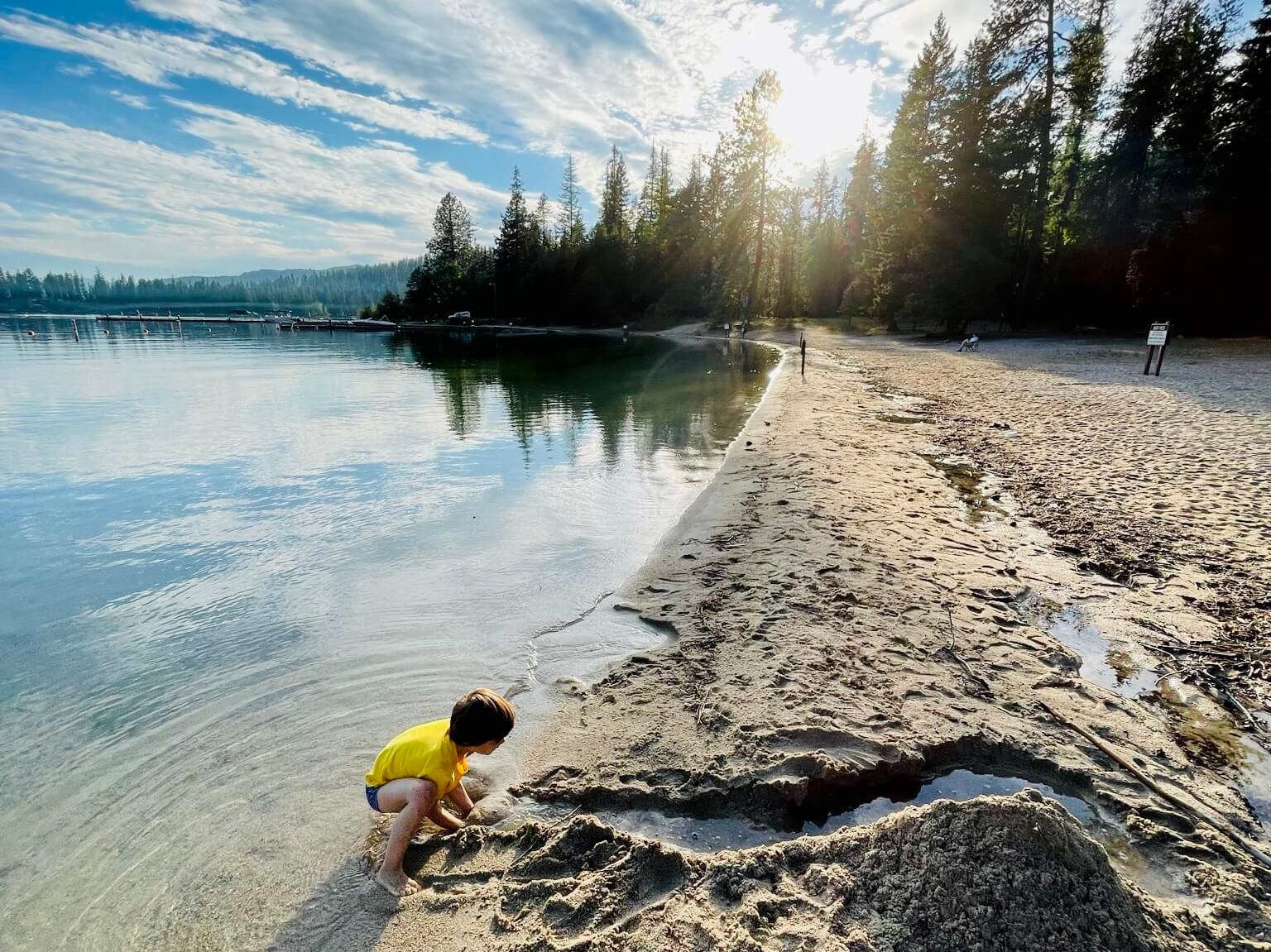 kid plays in lake