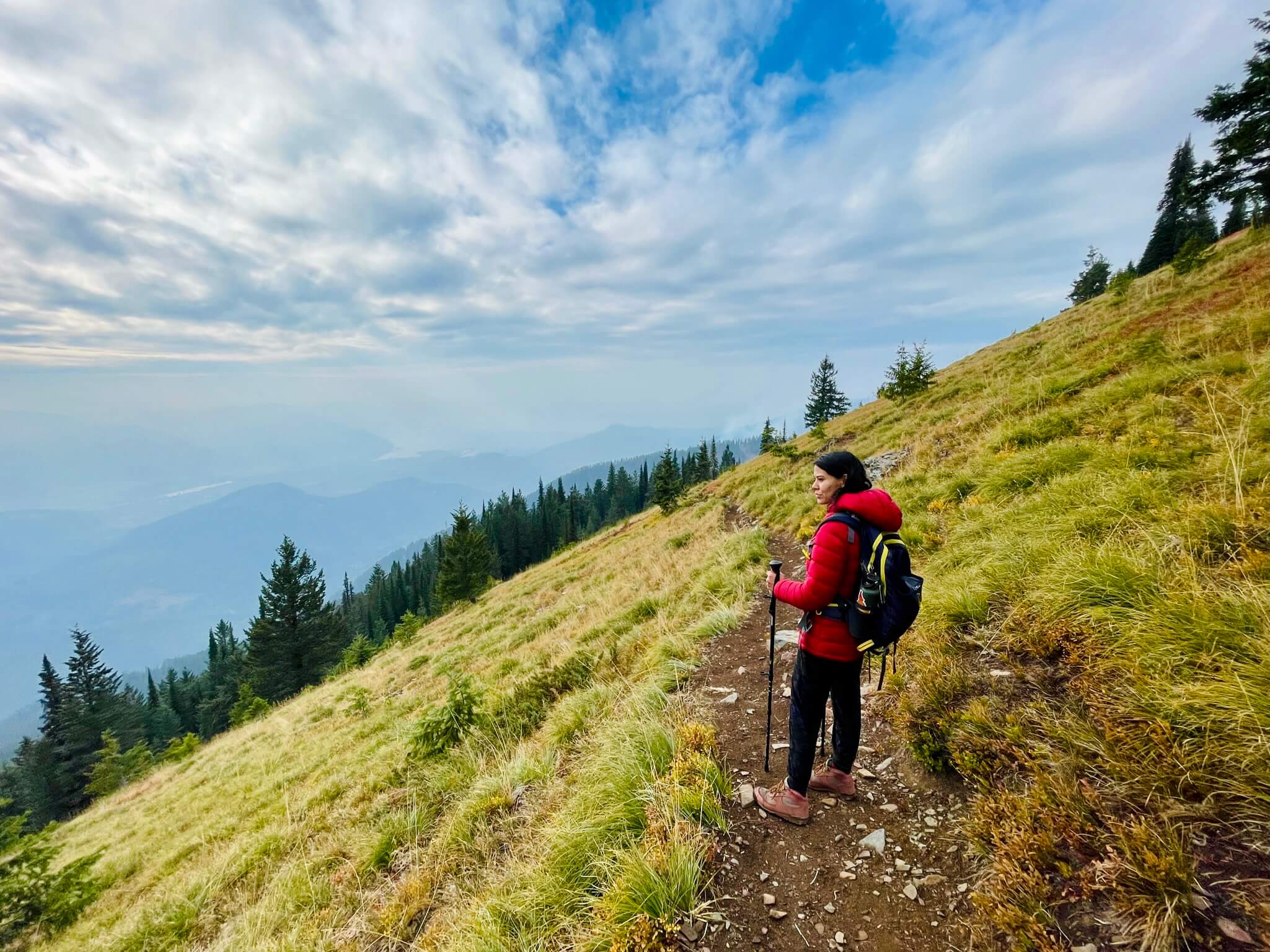 woman walks on hiking trail