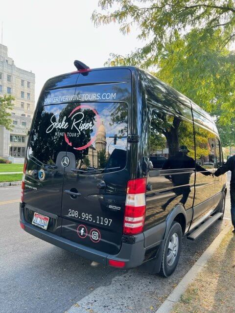 wine tour van sits curbside