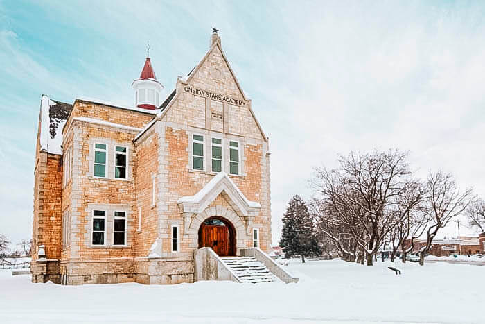 Oneida Stake Academy, snow-covered in Preson in a winter landscape.