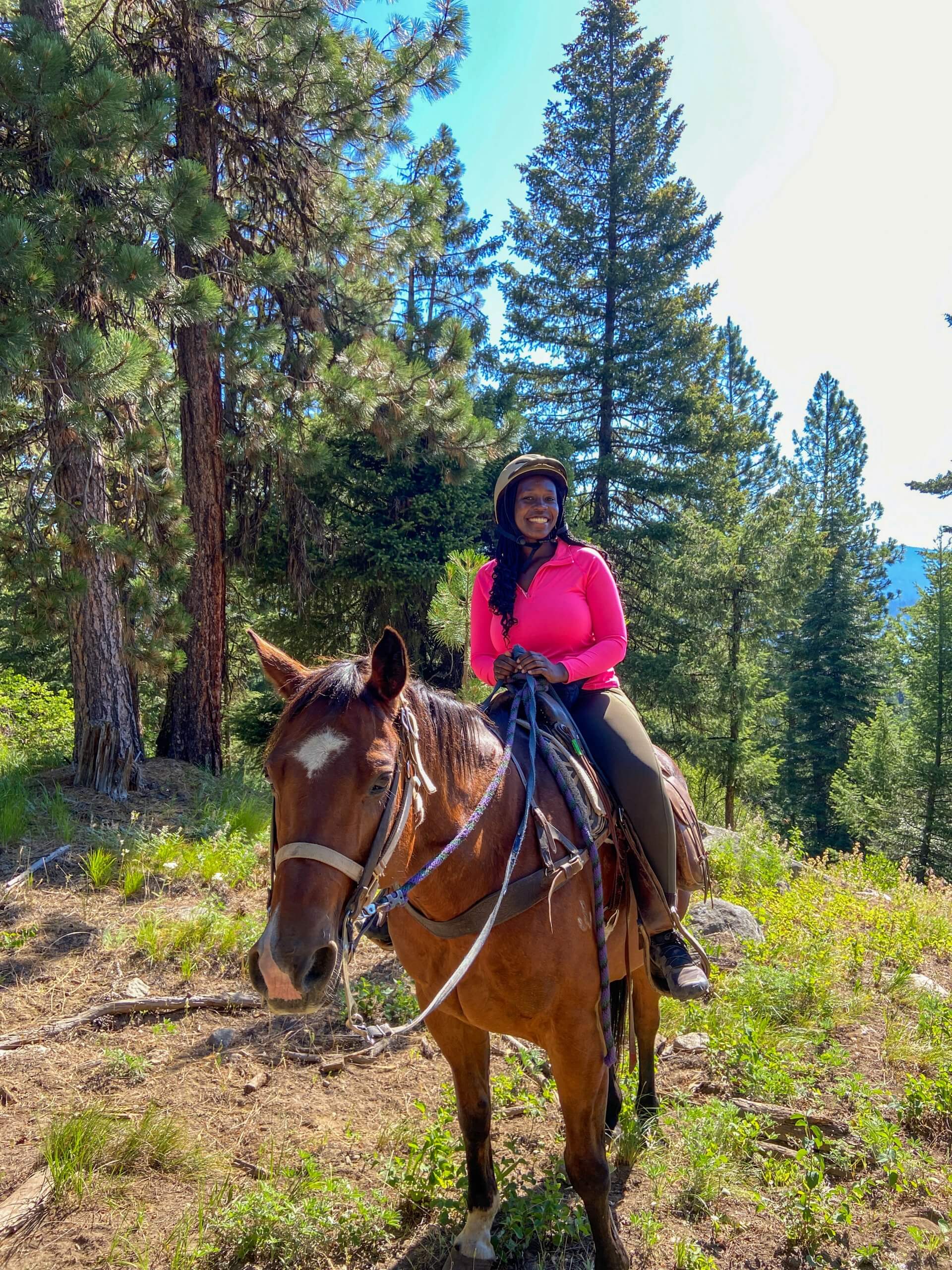 lady rides a horse in McCall