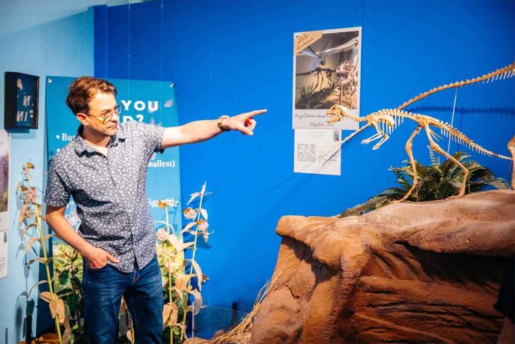 A man points at an exhibit at the Idaho Museum of Natural History in Pocatello.