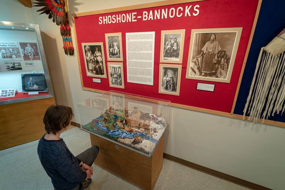 A person looks at a display at the Shoshone Bannock Tribal Museum in Fort Hall. 