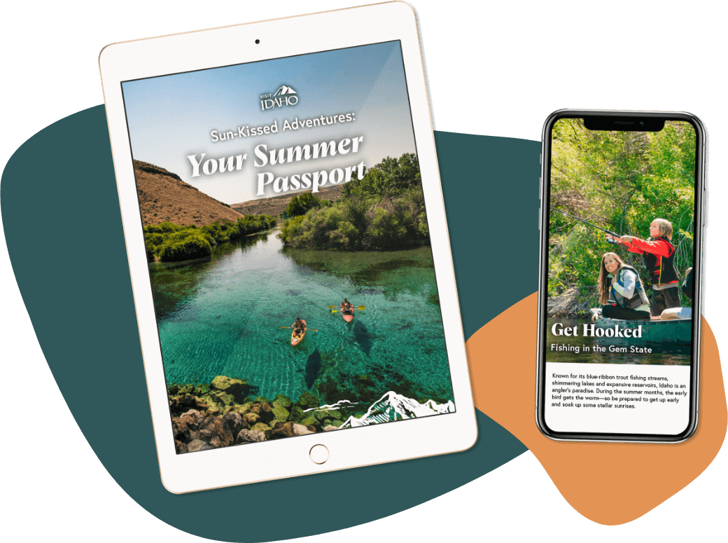 An iPad showing the words, "Sun-Kissed Adventures: Your Summer Passport" over an image of two people paddling kayaks in a body of turqouise water beside a phone showing the words, "Get Hooked: Fishing in the Gem State" over an image of two adults seated in a canoe beside child standing up and casting a fishing line.