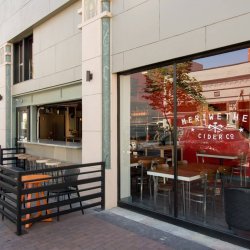 An exterior view of Meriwether Cider Company and the patio.