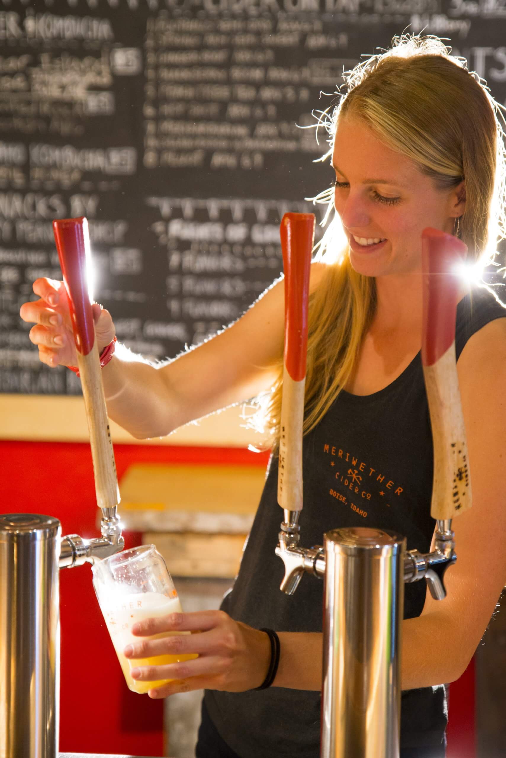 lady pours cider