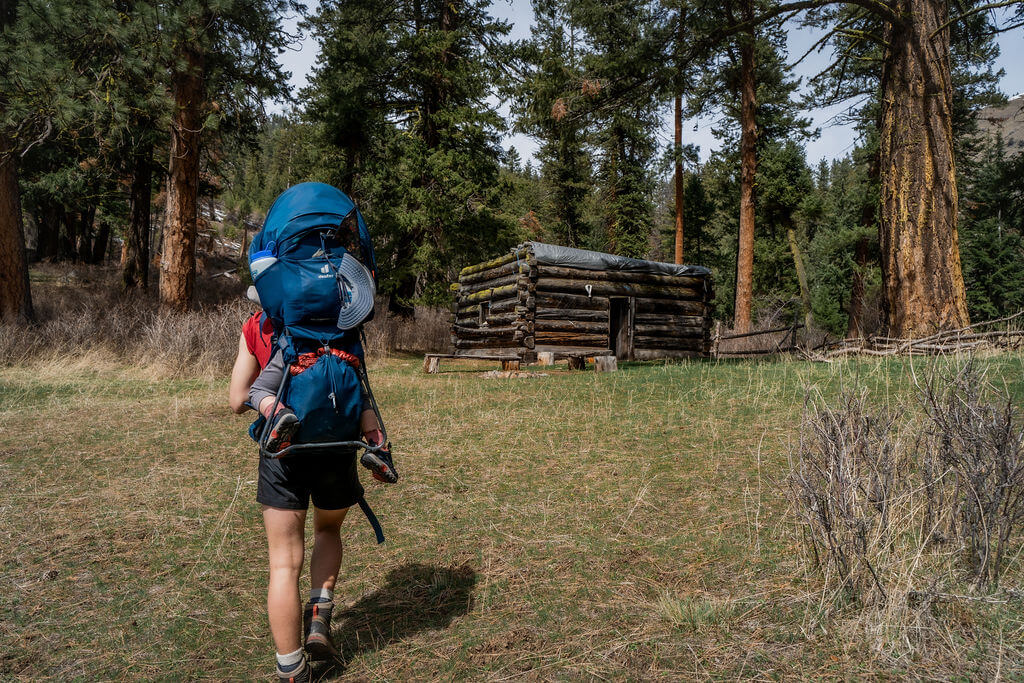 lady hikes to abandoned cabin