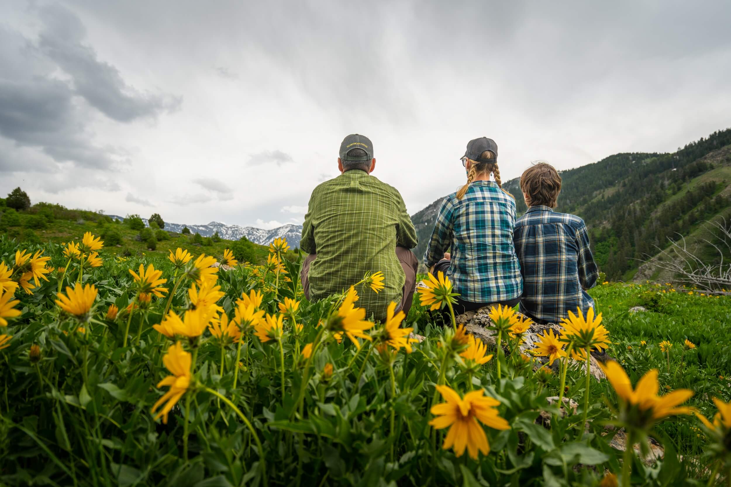 a family sits on a hiking trail in southeast Idaho.