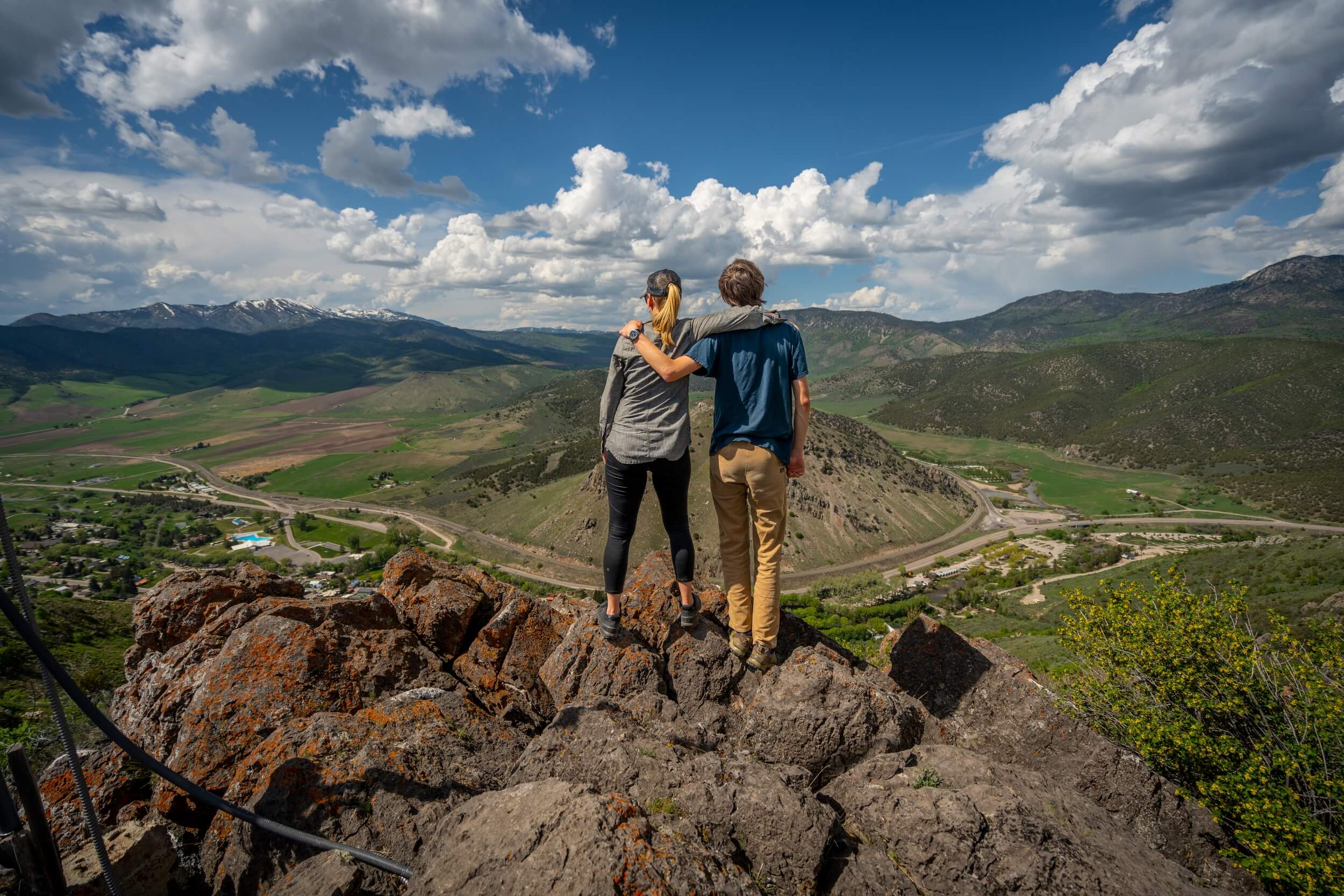 people stand on top of Mount Moh looking at lava hot springs