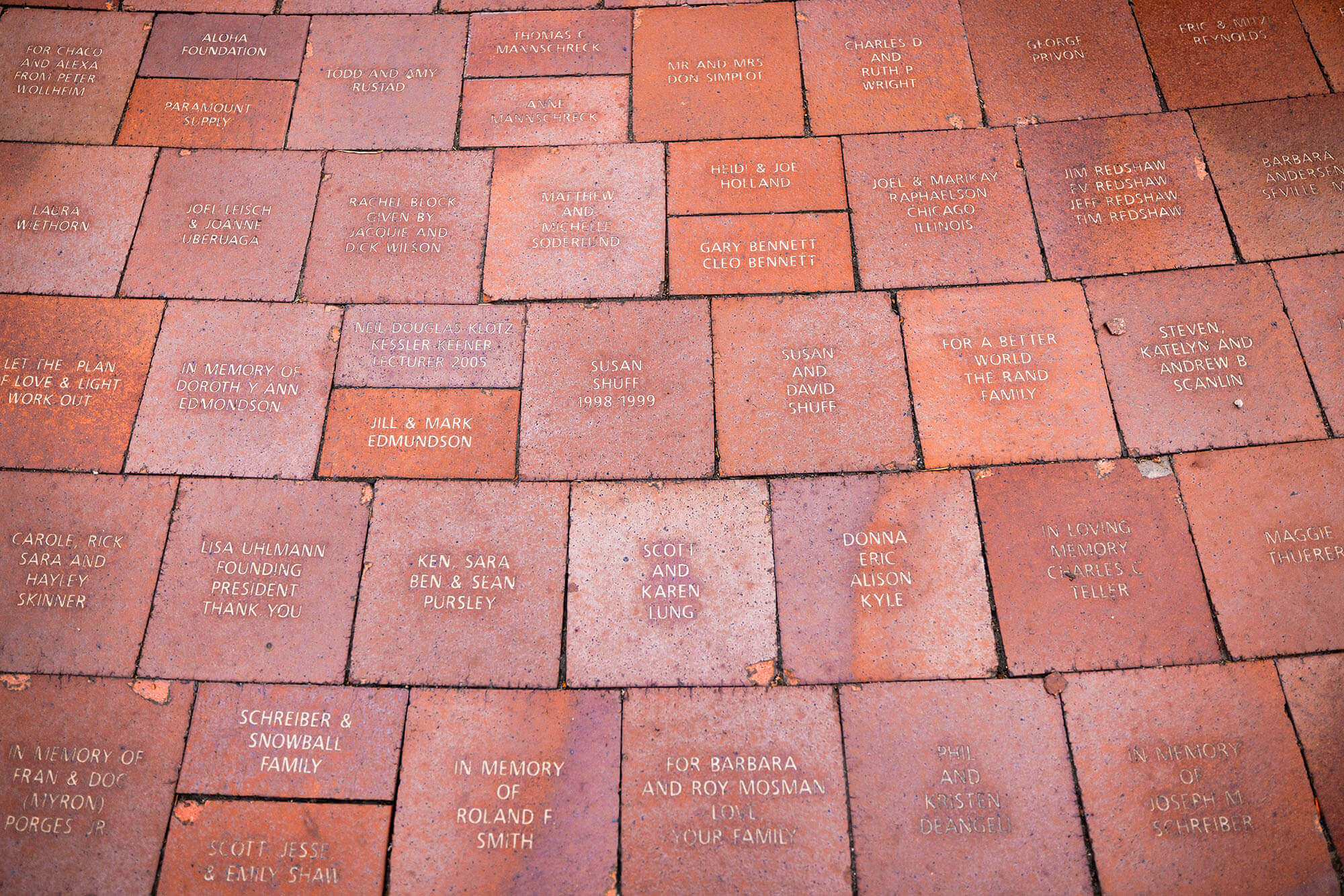 Several rows of bricks with name dedications etched into them.