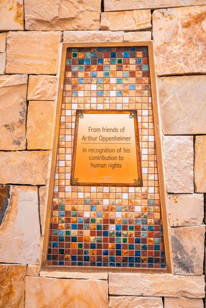 A monument at the Idaho Anne Frank Human Rights Memorial dedicated to Arthur Oppenheimer, made of multi-colored tiles.