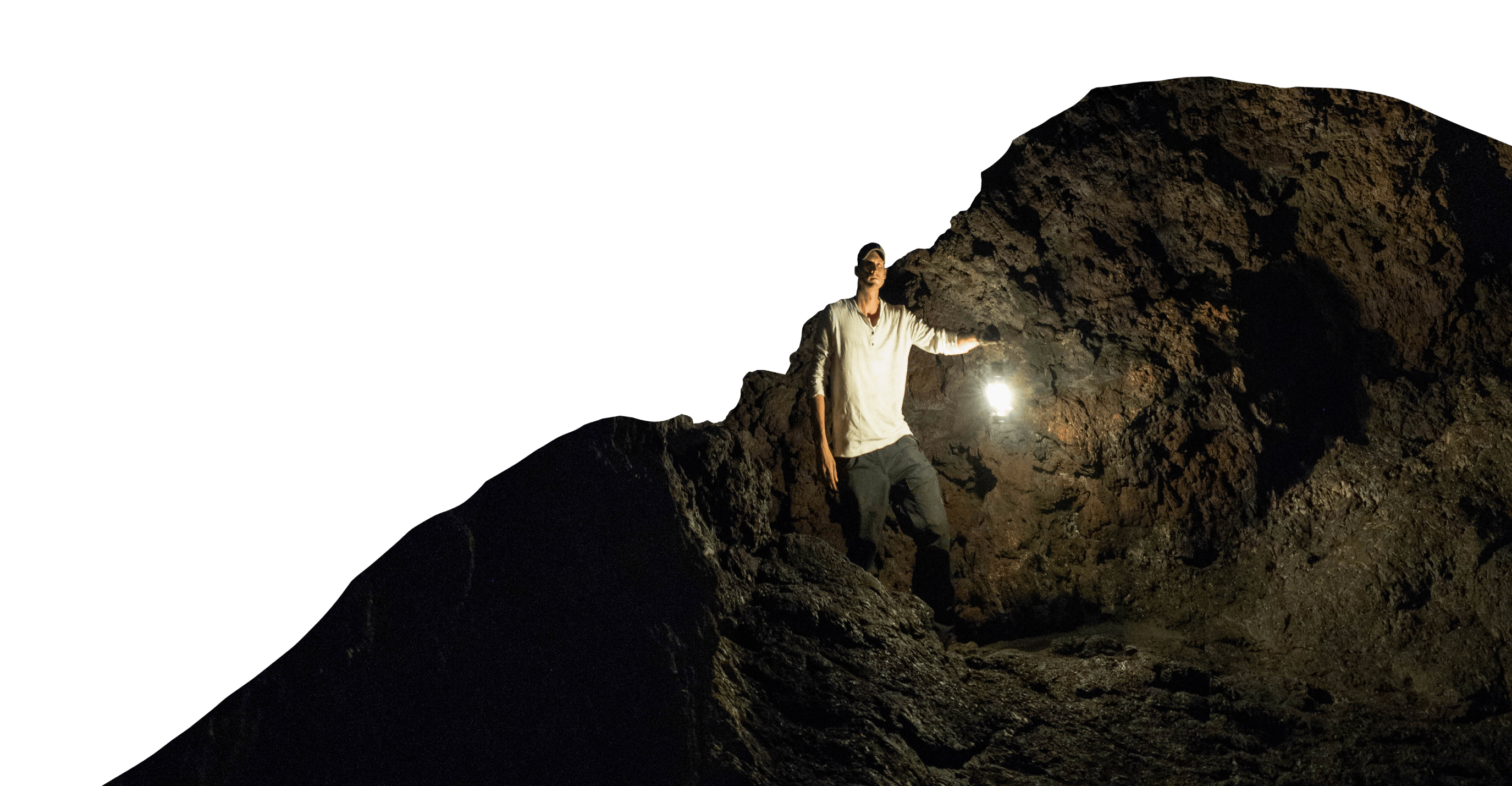 A man holds a lantern while stargazing at Craters of the Moon National Monument & Preserve.