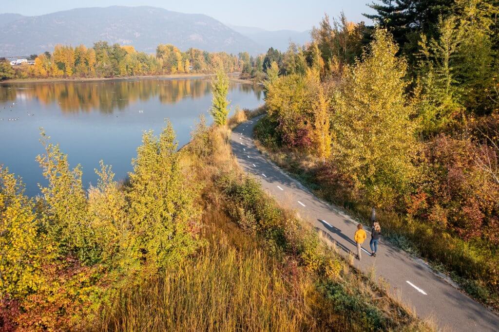 two people on a walk on Sand Creek Trail, near Sandpoint in Idaho