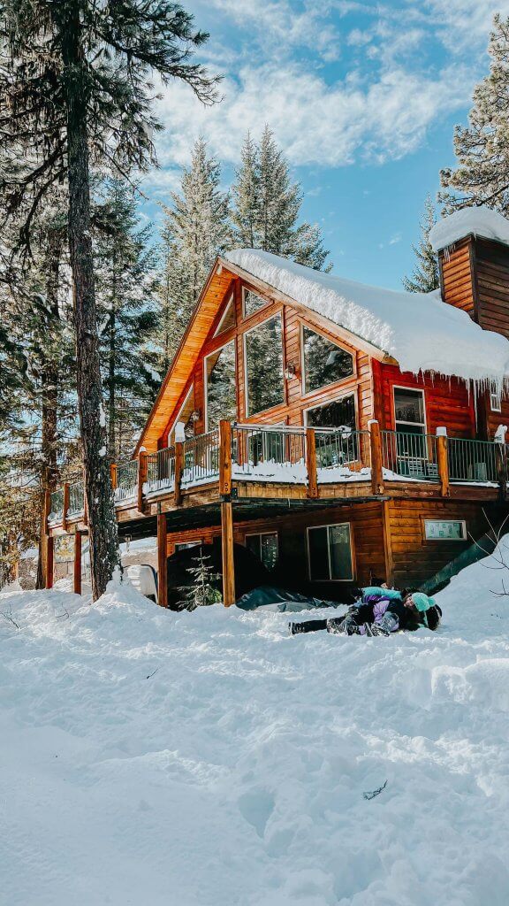 Snow-covered winter cabin in McCall, Idaho with a serene outdoor setting