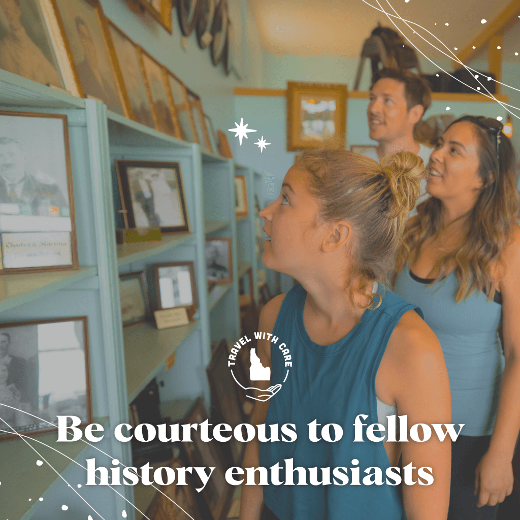 The words Be Courteous to Fellow History Enthusiasts beside an image of people viewing historic photos on display shelves.